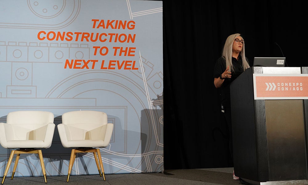 A woman standing at a podium