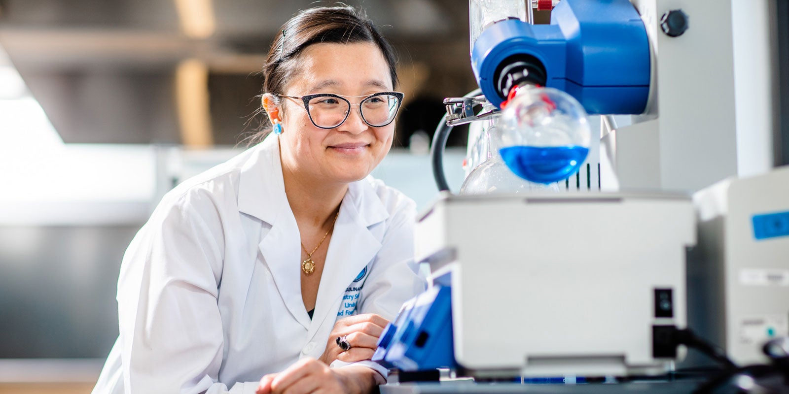 A woman in a lab coat A woman in a lab coat
