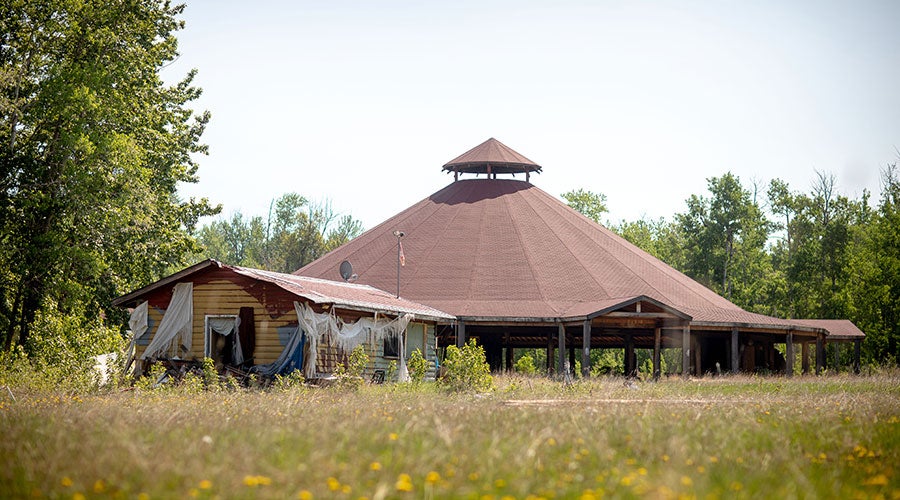 Eagle Bluff Light with a roof and a tent in the middle of a field
