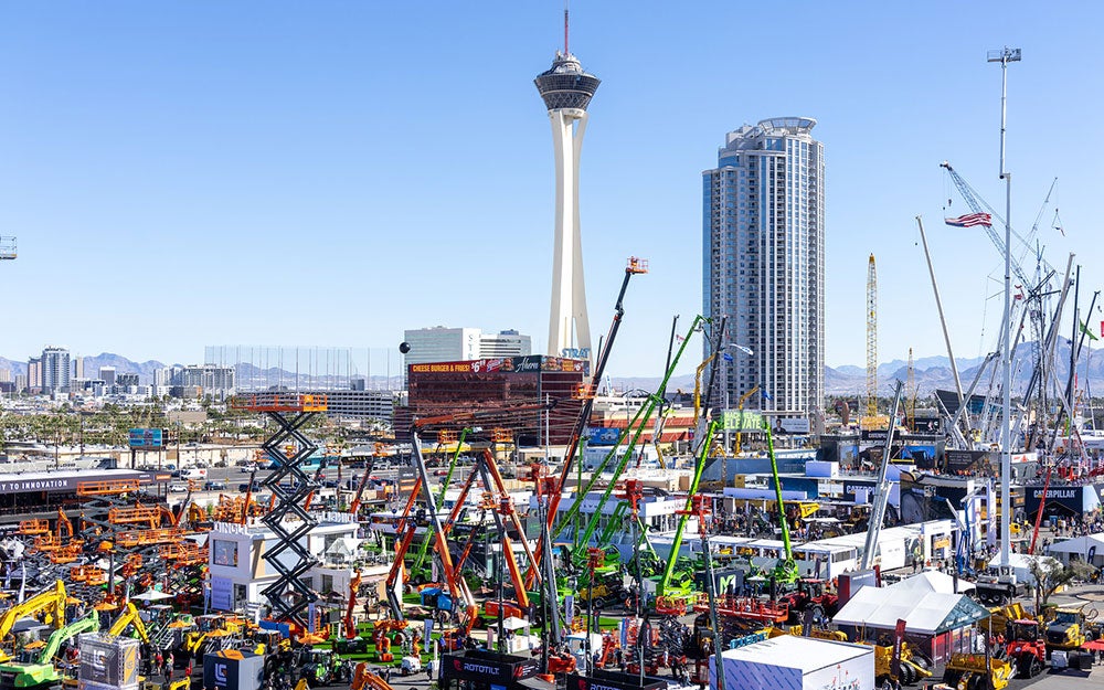 A large city with cranes and buildings