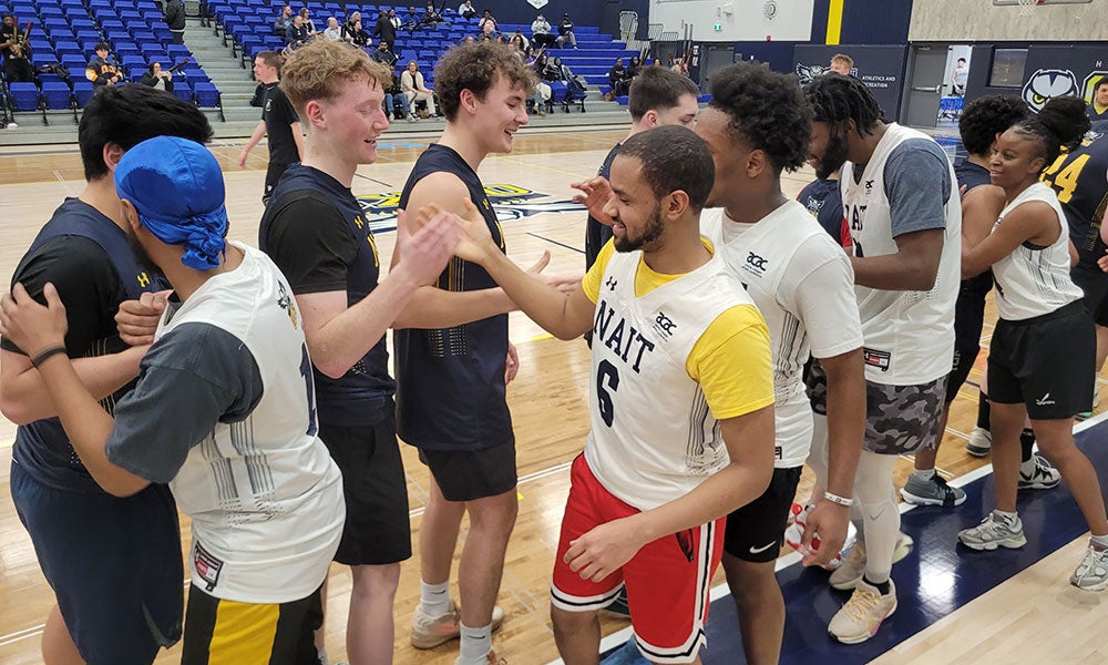 A group of men in a basketball court