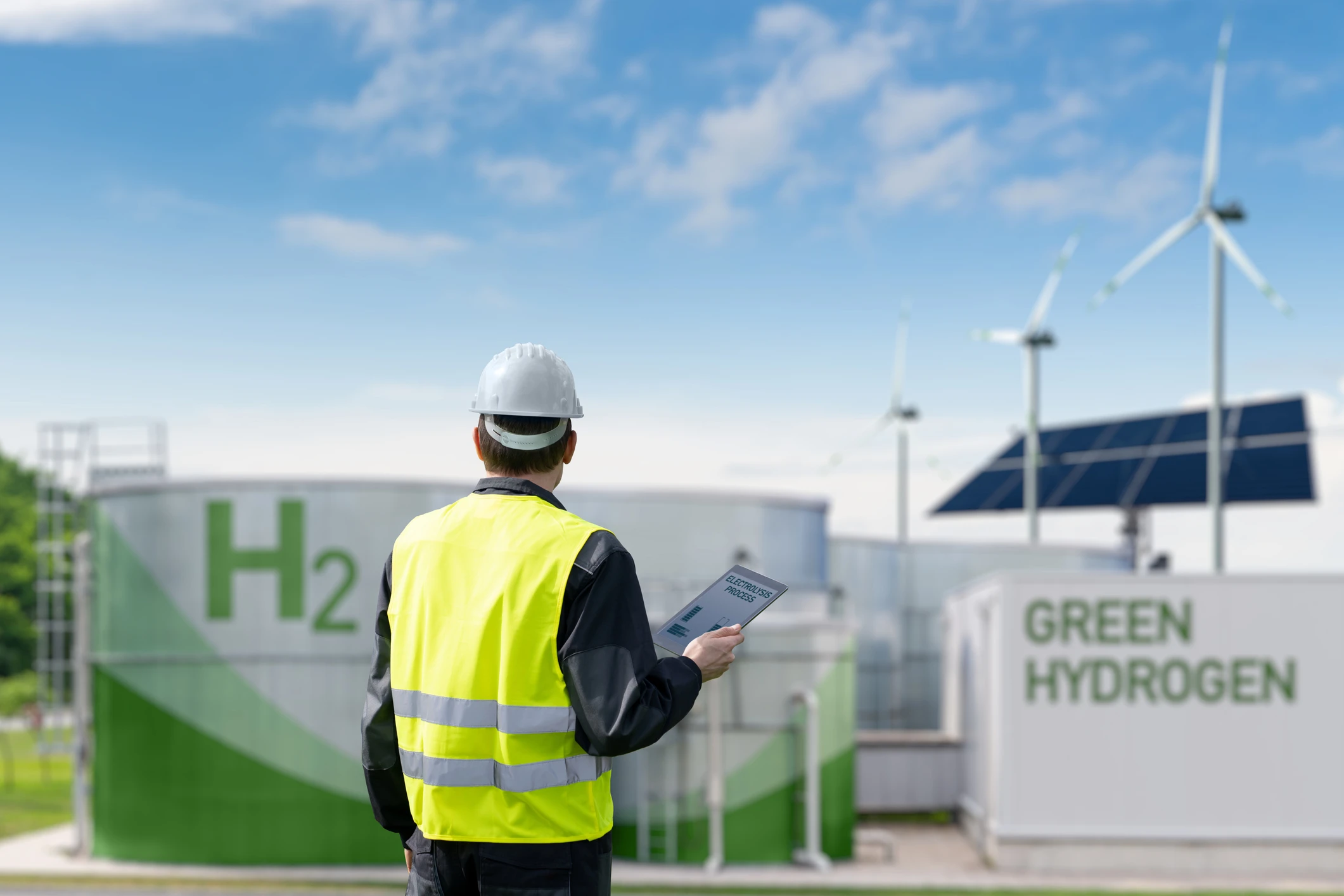 Engineer looking at a hydrogen storage unit.