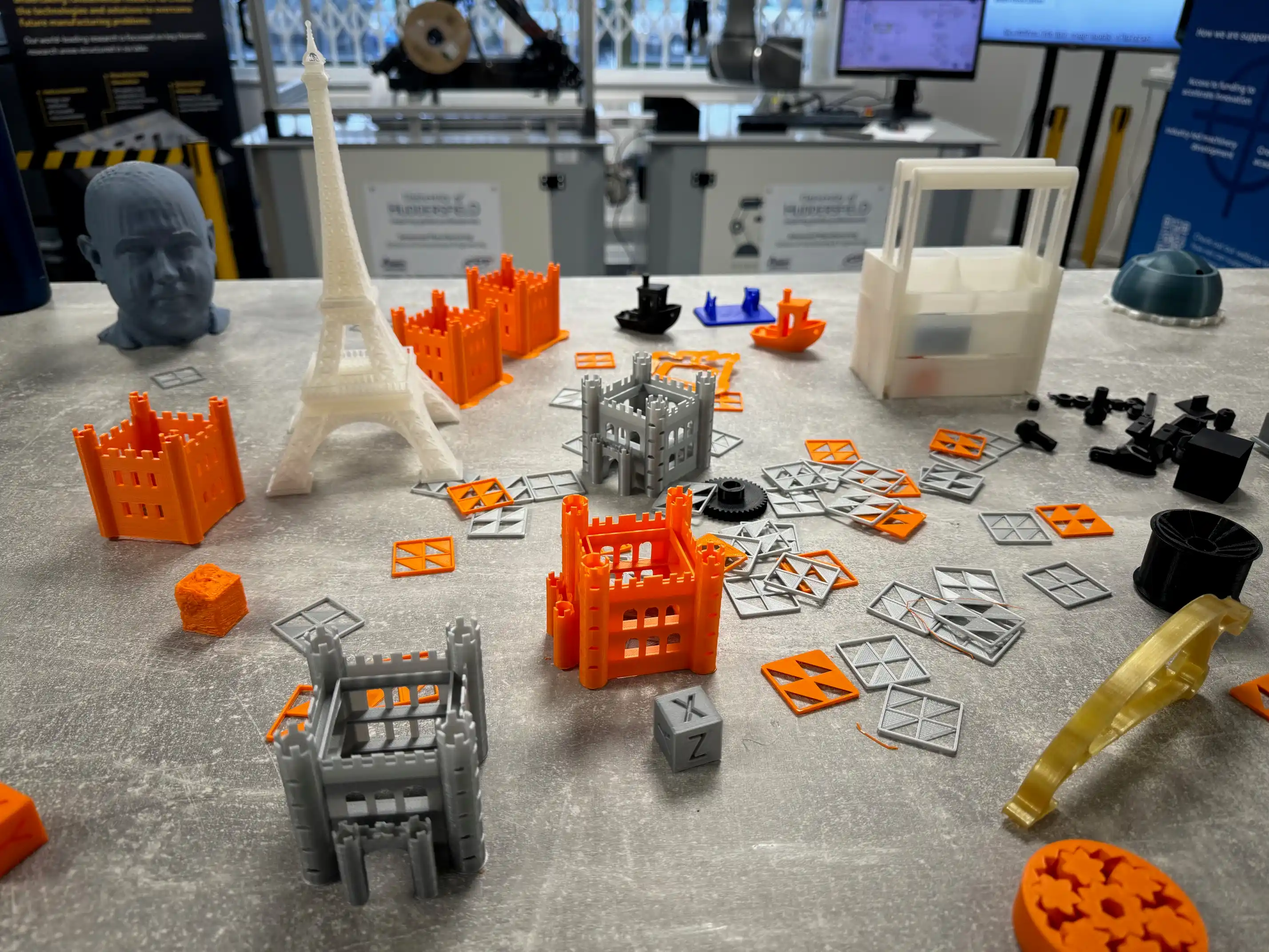 A group of 3D printed plastic buildings including the Eiffel Tower.