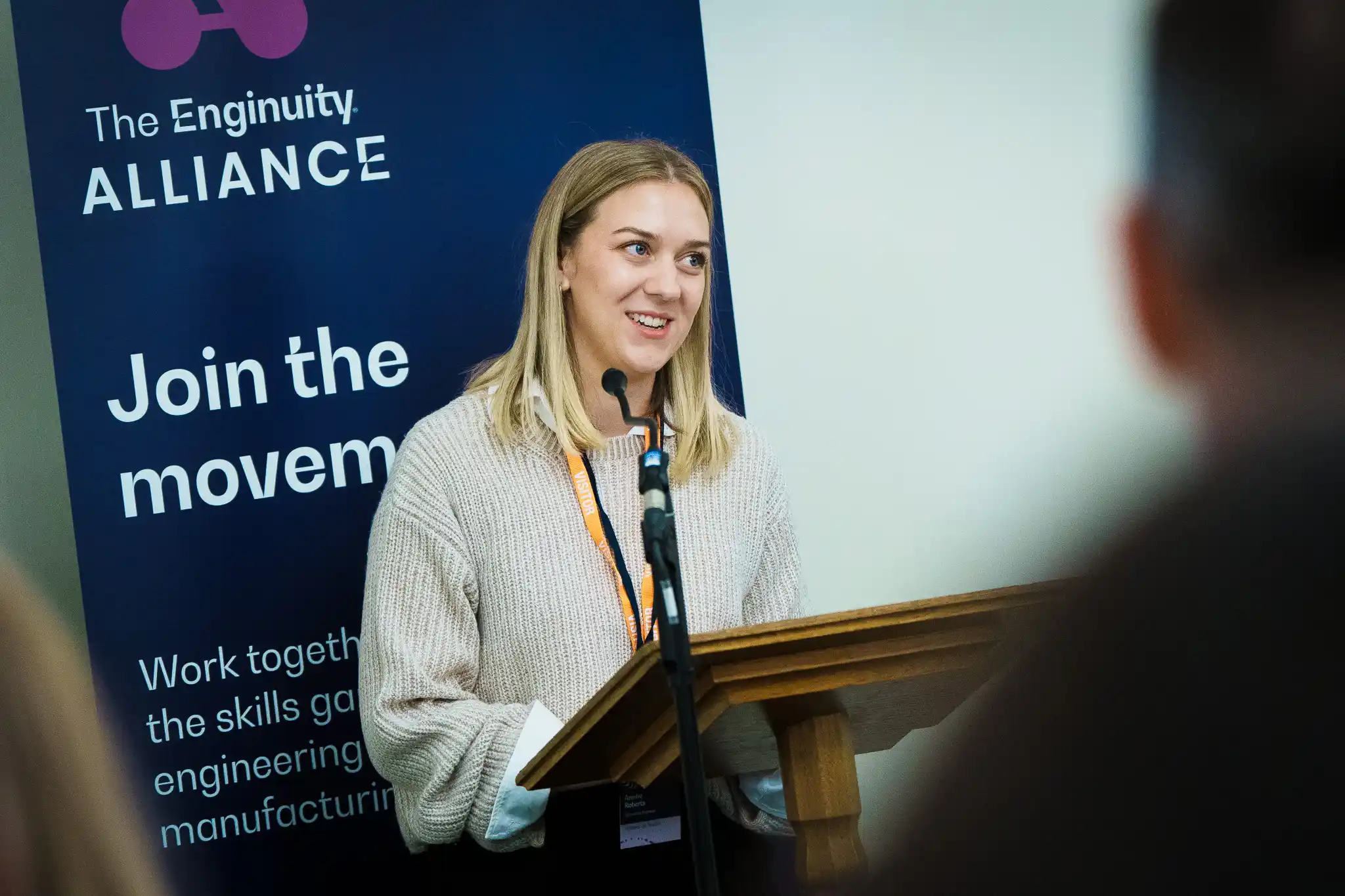 Anisha Roberts speaking on stage at the Enginuity Alliance launch event