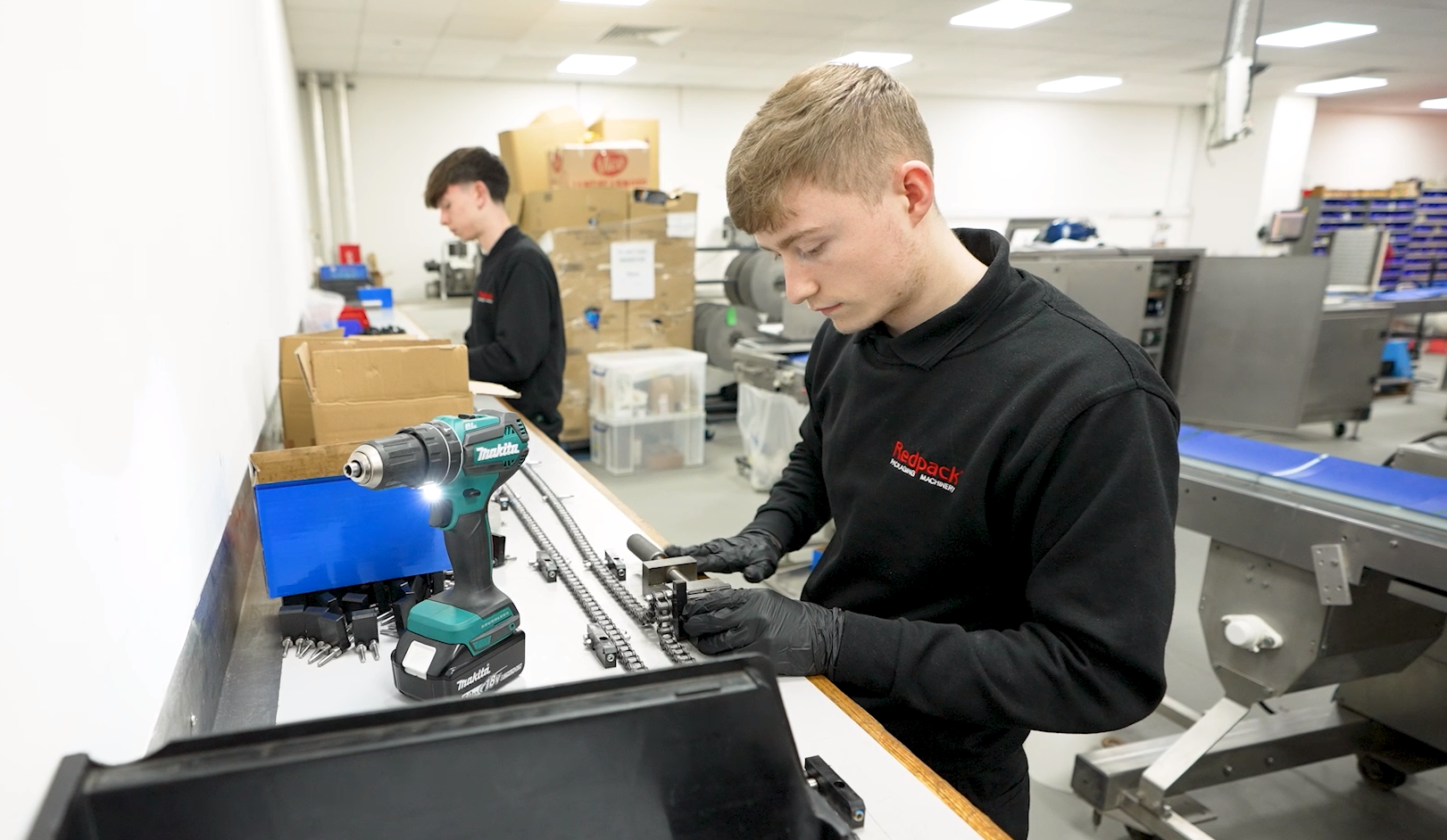 T Levels students working in Redpack's packaging machinery factory