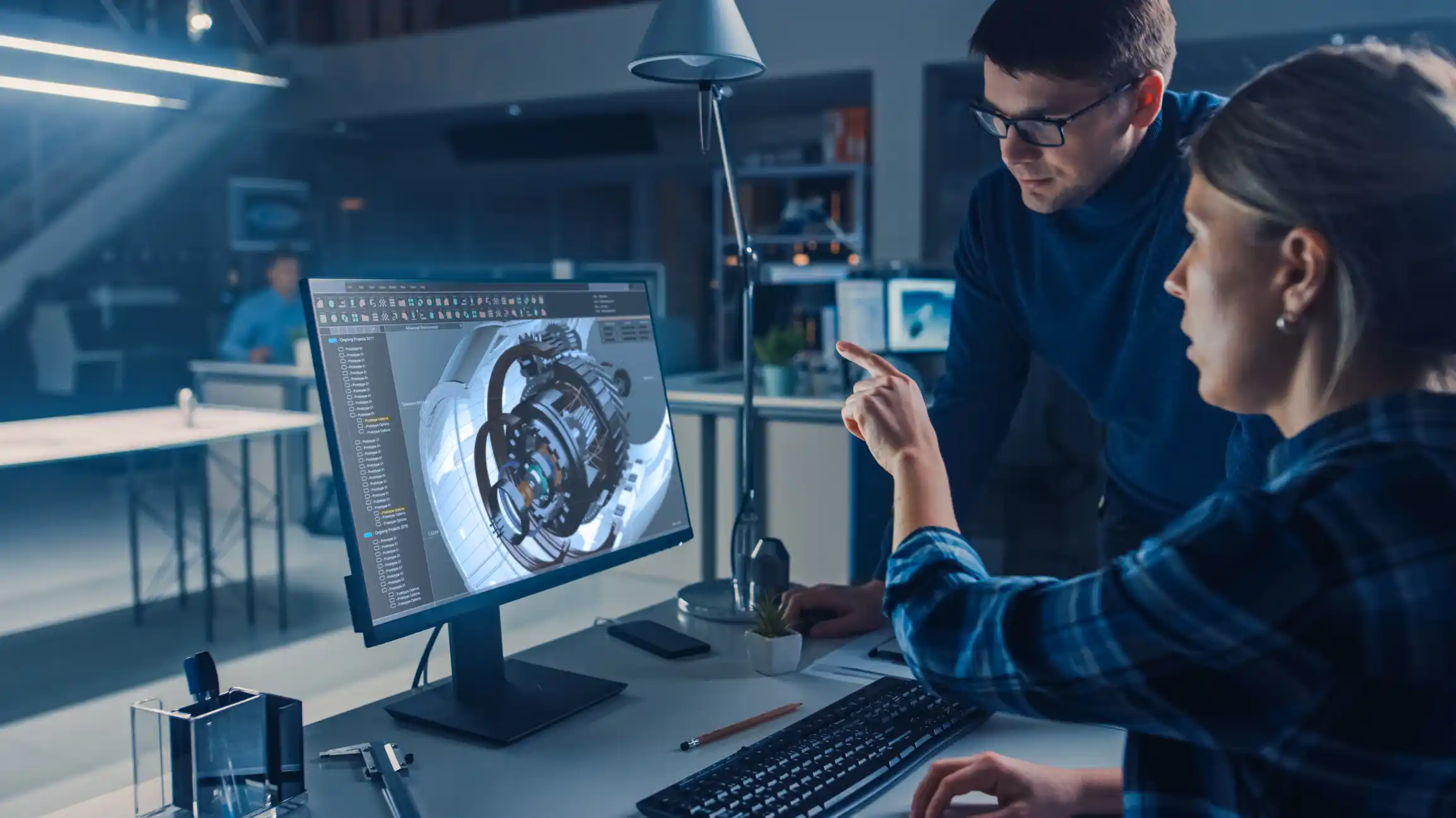 Engineer working on desktop computer.