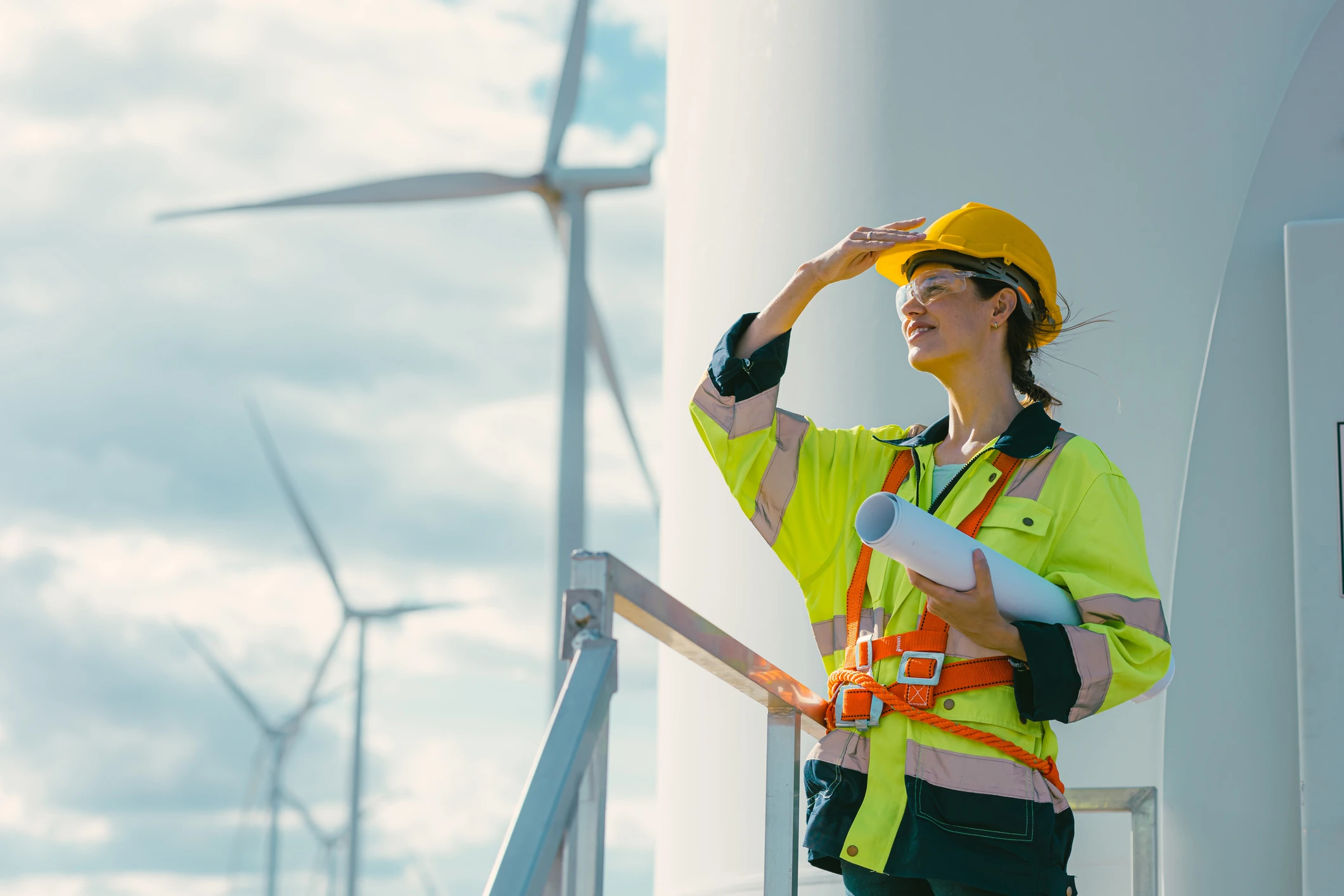 Female engineer with wind turbines 