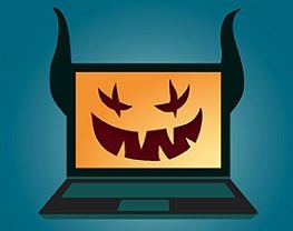 Cartoon of a laptop with the grin of a Halloween pumpkin and devil ears