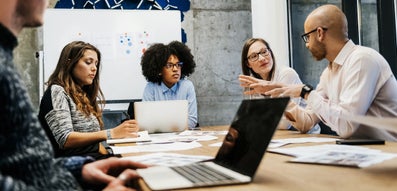 A group of people are holding a meeting.