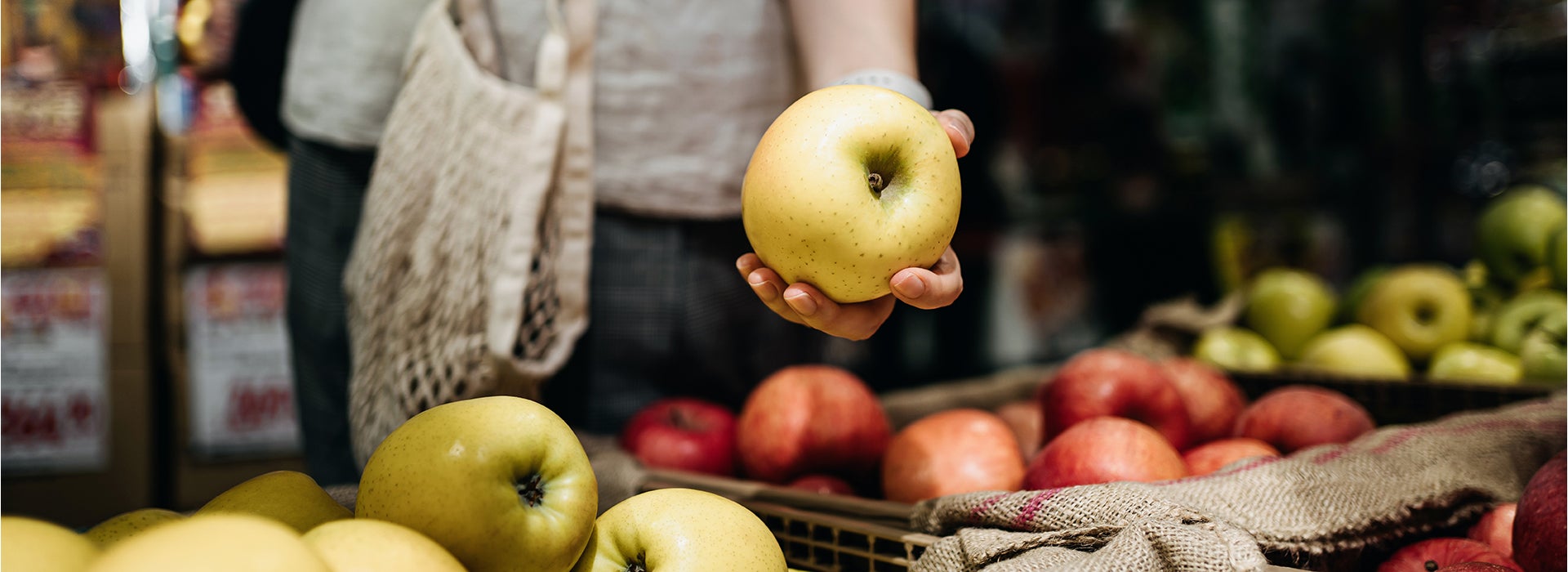 Person is holding an apple 