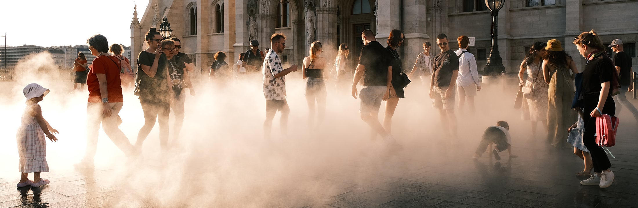 A group of people walking in a city