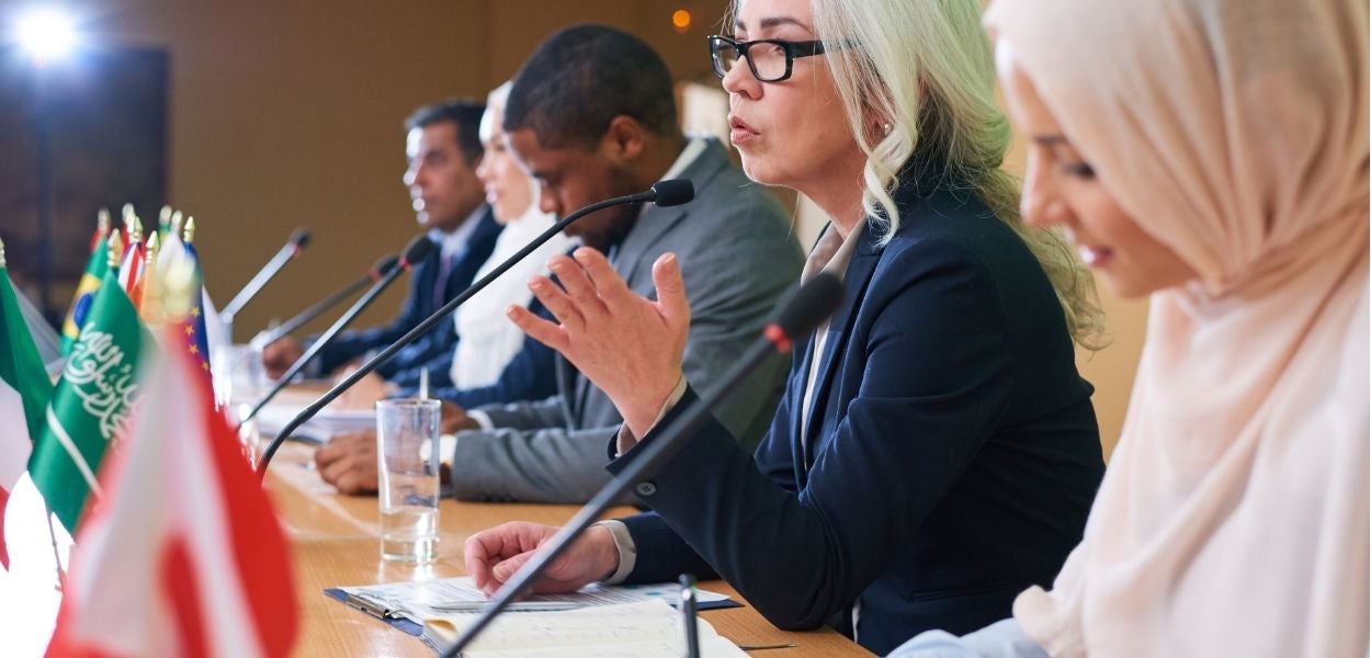 A group of women speaking at a congress 