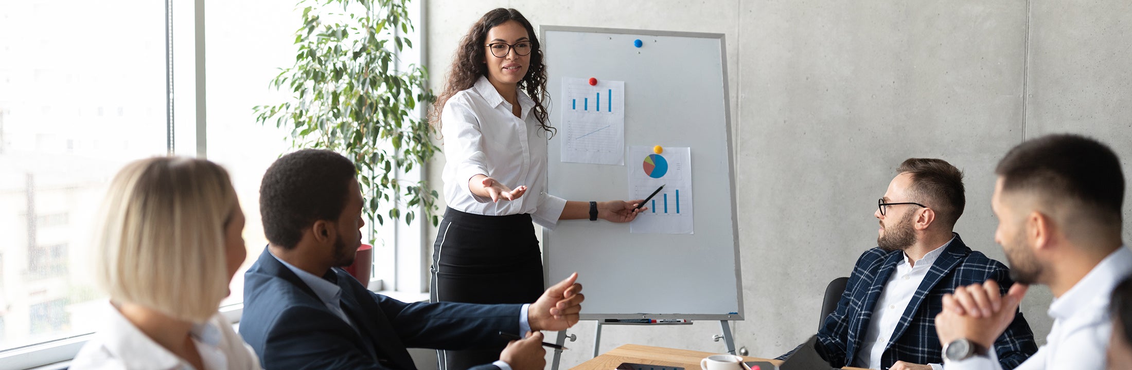 A woman standing in front of a whiteboard