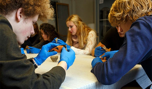 Students analyzing artifacts 