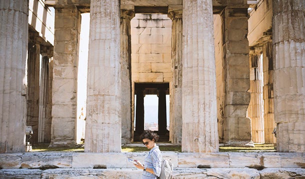  Woman walks around archaeological site