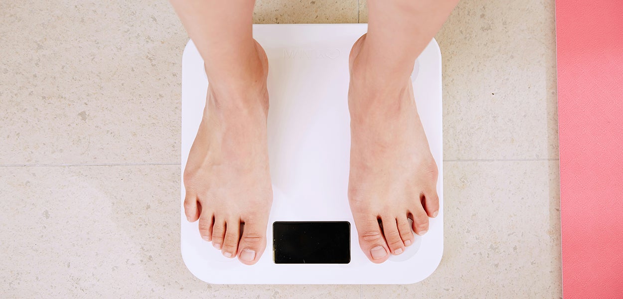 Standing on a weight scale