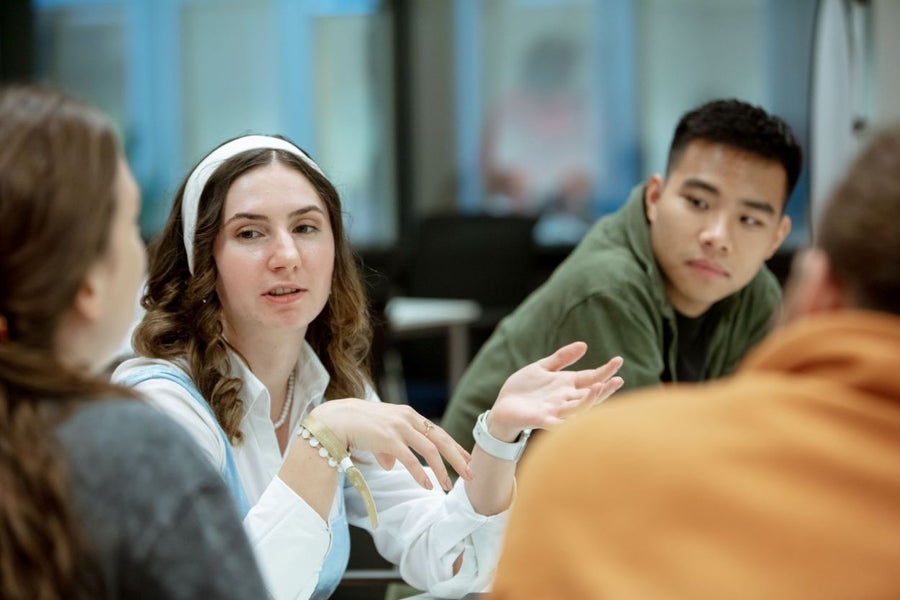 A group of people are in conversation