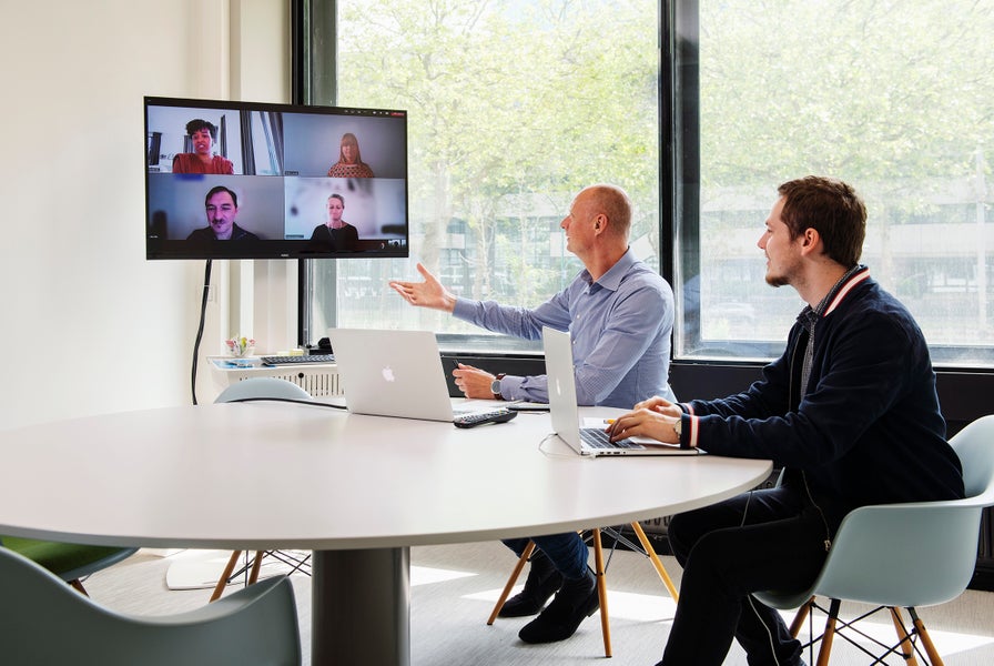colleagues talking to each other online and on location