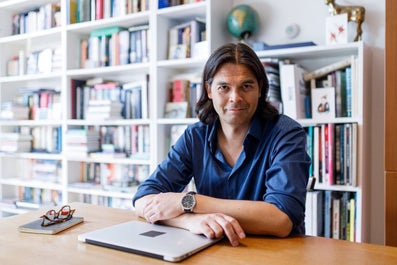 A man at a desk with a laptop