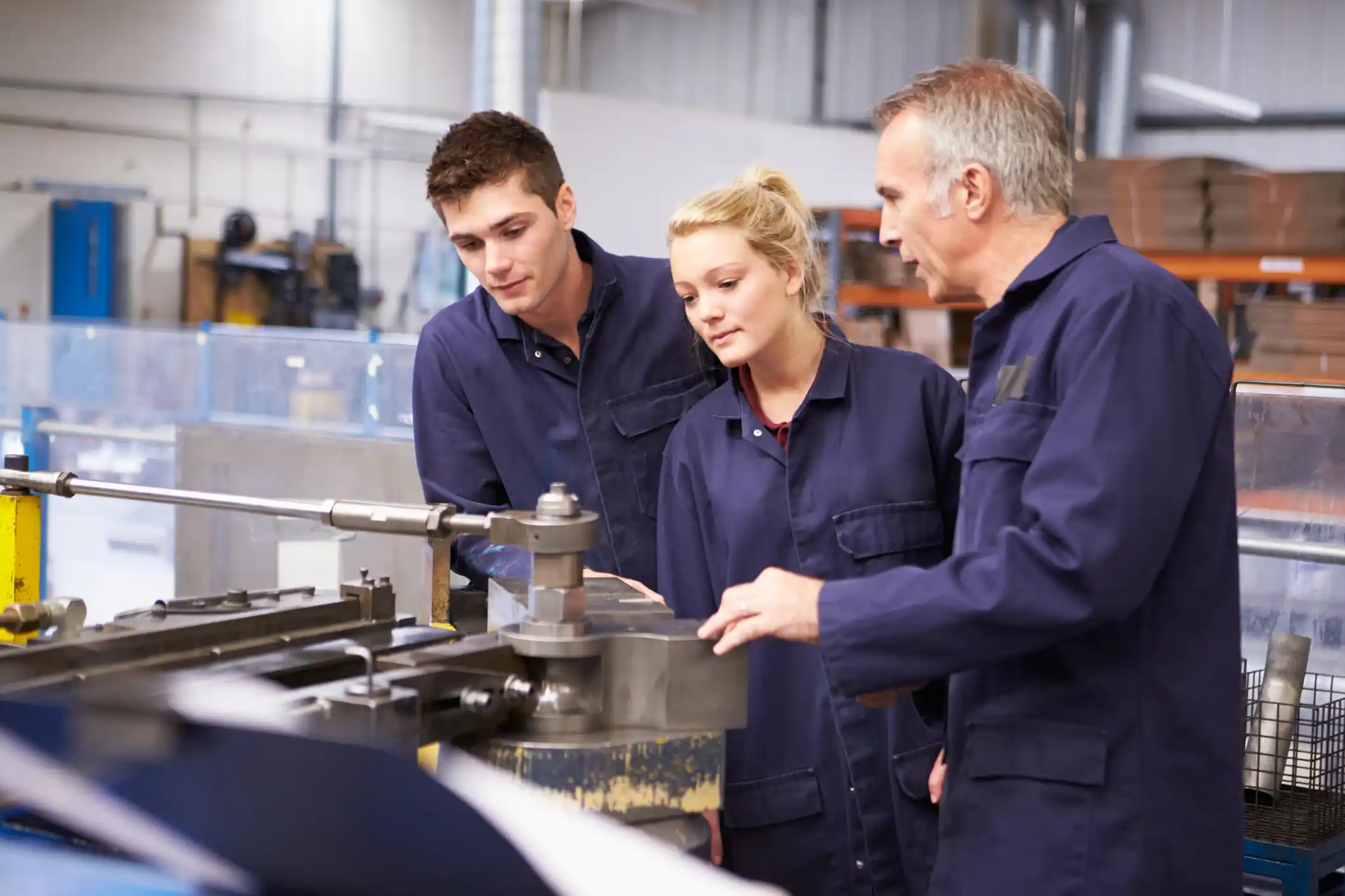 Engineering students and teacher in workshop