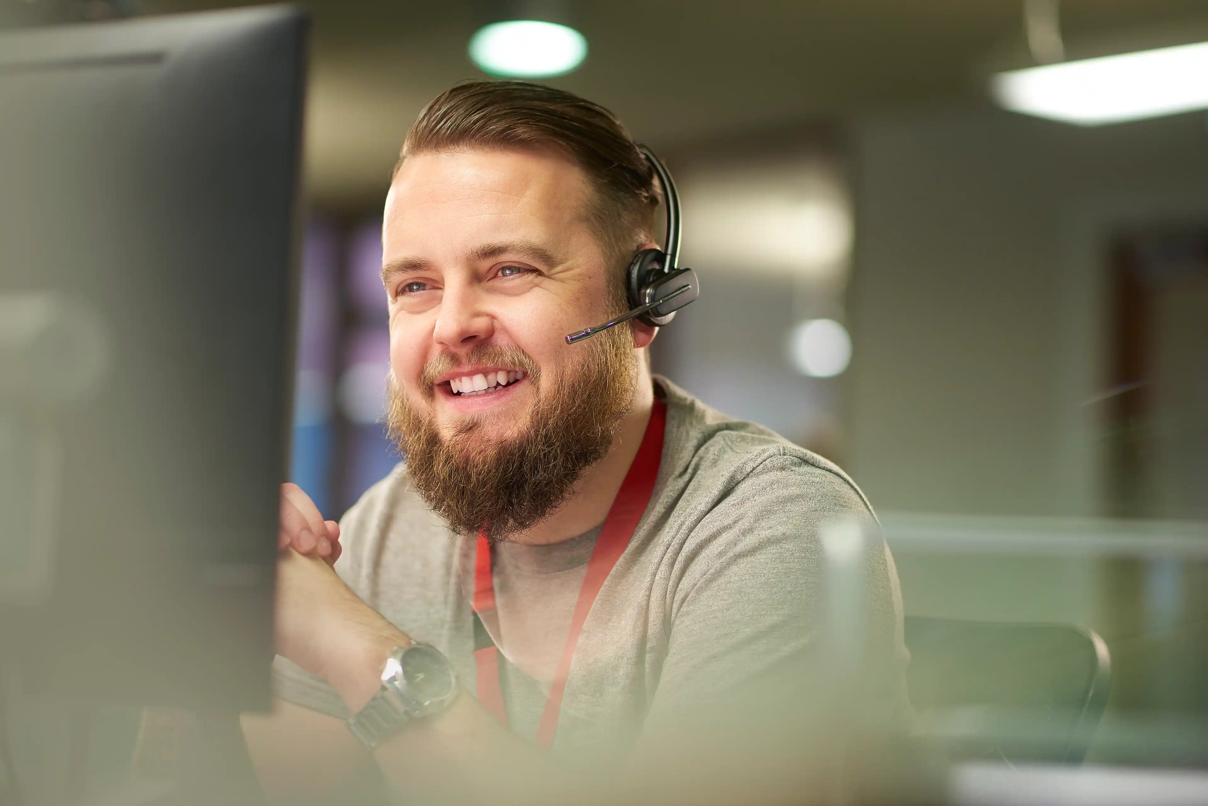 Customer success representative smiling wearing a headset