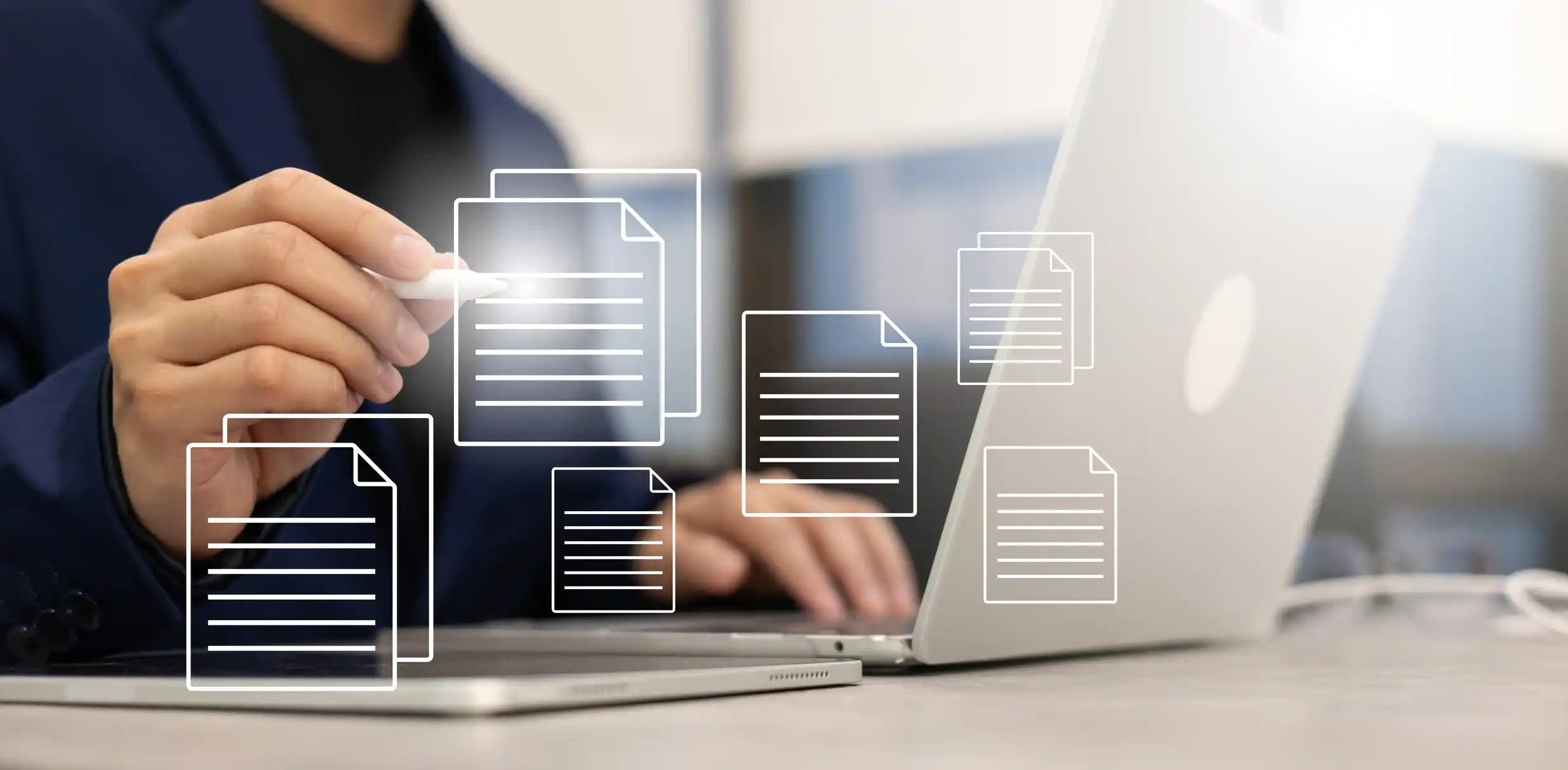 visual of document symbols being projected out of a laptop computer screen, a user selects a file