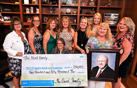 Hunt family holding big check