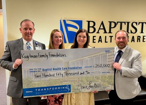 Jane and Pete Lauter check presentation