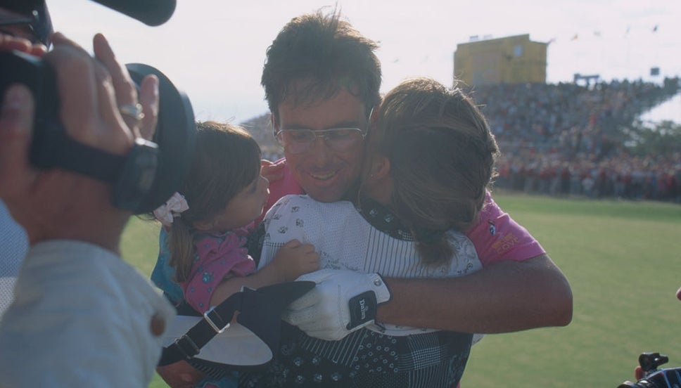 Ian Baker-Finch hugs his children after winning The 120th Open