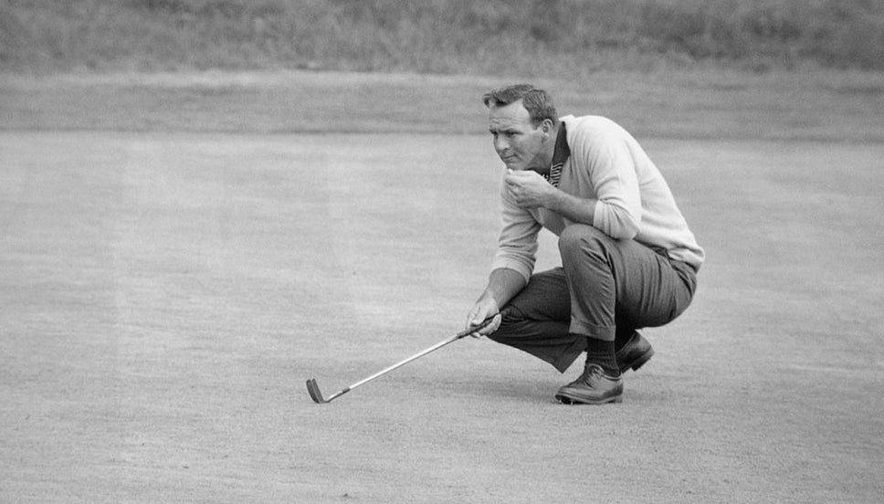Arnold Palmer lines up a putt at The Open