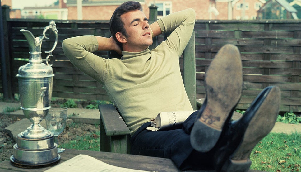 Tony Jacklin relaxes beside the Claret Jug after winning The Open