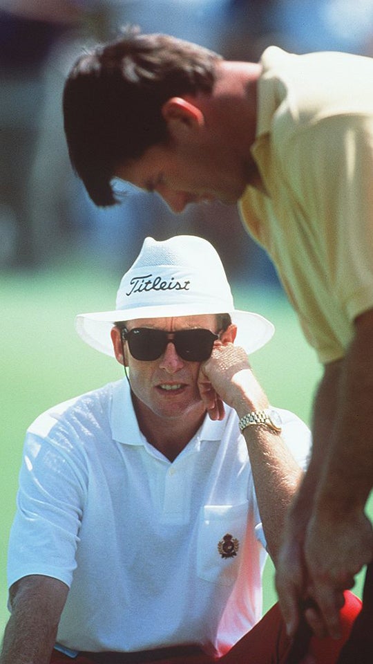 David Leadbetter observes Nick Faldo as the three-time Champion Golfer putts