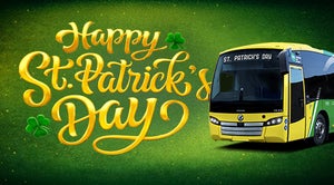 A graphic design saying happy St. Patrick's Day. Below the text is a green and yellow Bus Éireann Bus