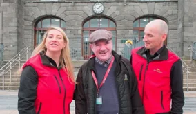 Photo of Travel Assistance Scheme service user, George Moore (who took part in the 1000th assist) and our Limerick Travel Assistants, Rose and Sean.