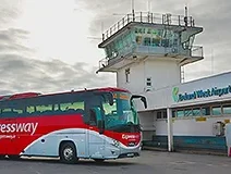 Image of a Bus Éireann Expressway bus parked in front of Ireland West Airport Knock