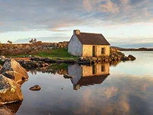 An old fisherman's cottage on a lake at Screebe in Connemara National Park in Galway in Ireland