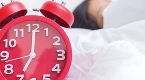 Daylight Savings (image of an alarm clock that says seven o'clock, with a head peeping out the top of the covers in the background)