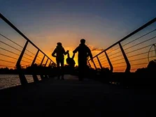 Family walking into the sunset on the boardwalk in Carrick-on-Shannon, County Leitrim