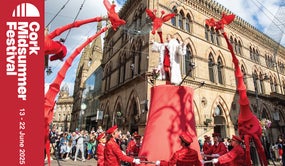 Image is of the giraffe float as it travels through Cork City for the midsummer festival 
