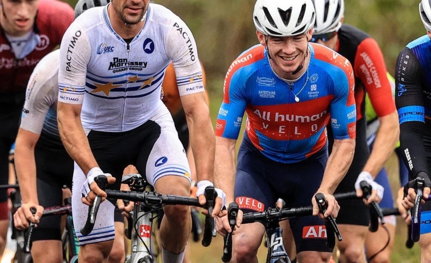 Daire cycling with a group of people in different coloured jerseys 