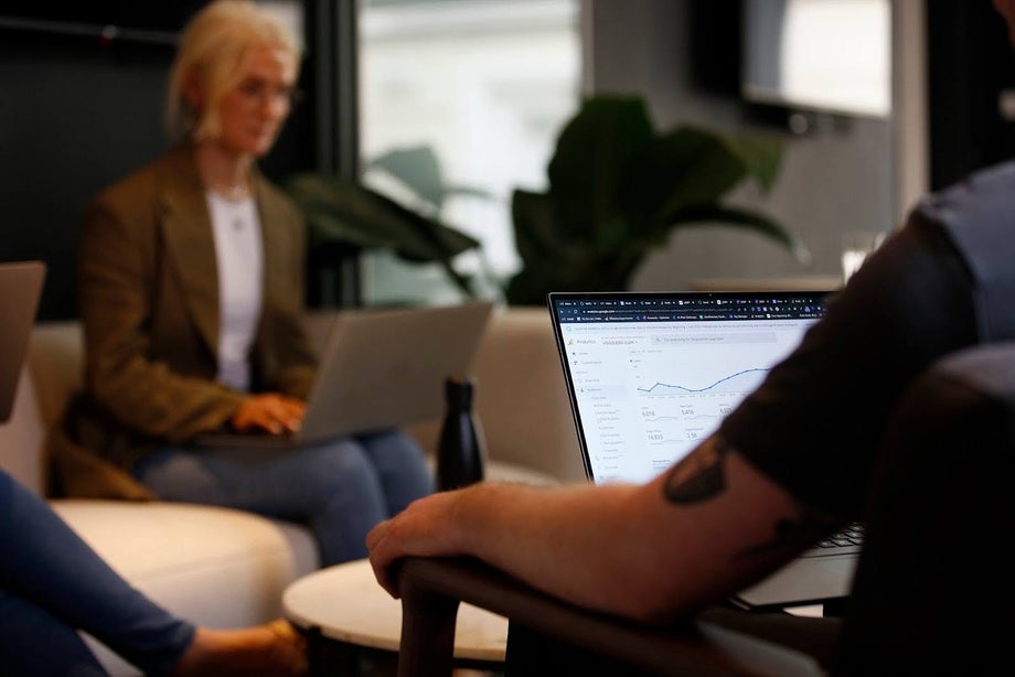 People sitting in a circle analysing data