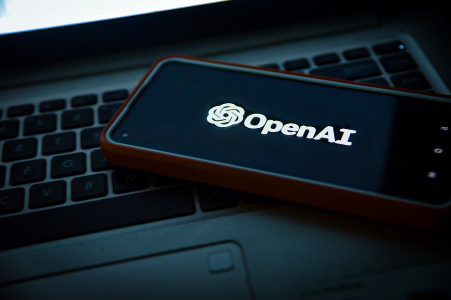 Phone displaying the OpenAI logo.