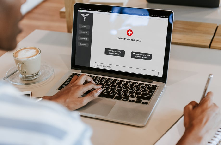 Person making a booking on a medical website using a chatbot