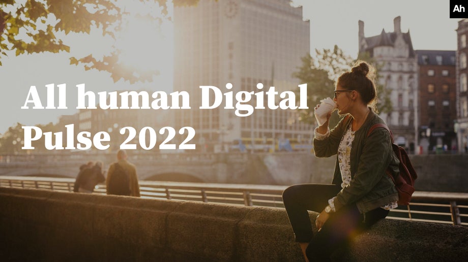 All human Digital Pulse 2022 cover image of a young woman drinking coffee near the Liffey river