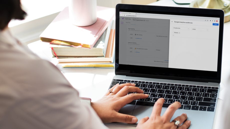 A close up of a laptop screen showing Google Analytics 4 Optimize integration. The screen shows the individual creating a Google Analytics audience.