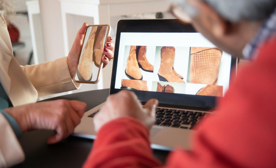 Two people compare a product on their desktop to the same on their mobile phone