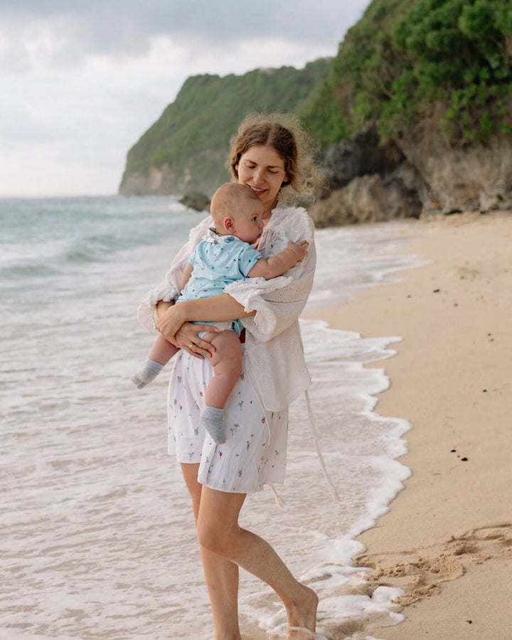Woman with baby on a beach