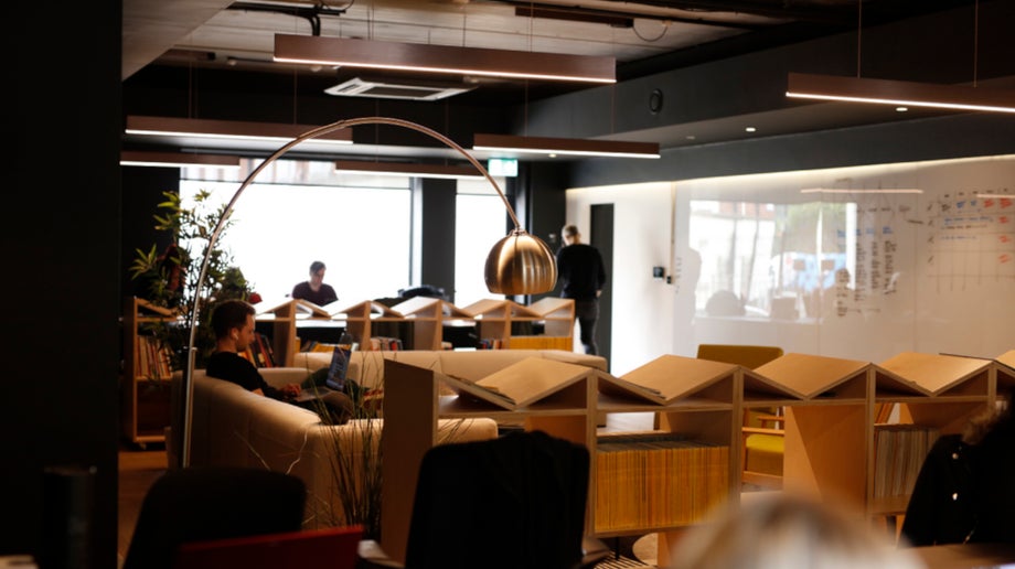 All human’s office space with modern low bookshelves and books.