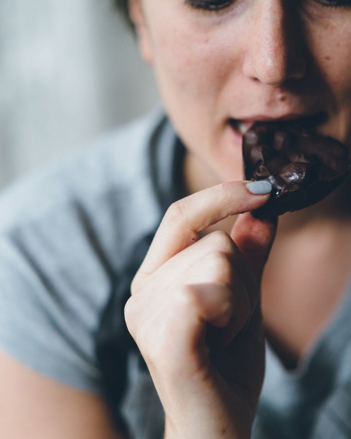 Person enjoying Lily O'Brien's chocolates