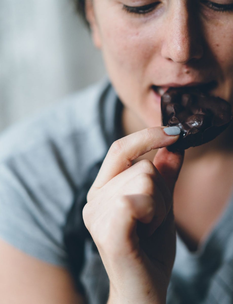 Person eating a chocolate